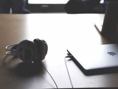 Picutre of Table with Laptop and Headphones